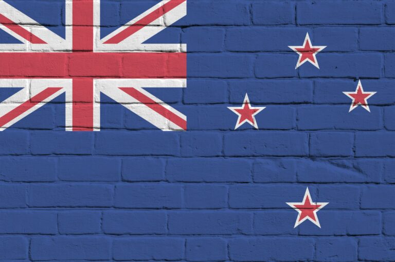 New Zealand flag depicted in paint colors on old brick wall close up